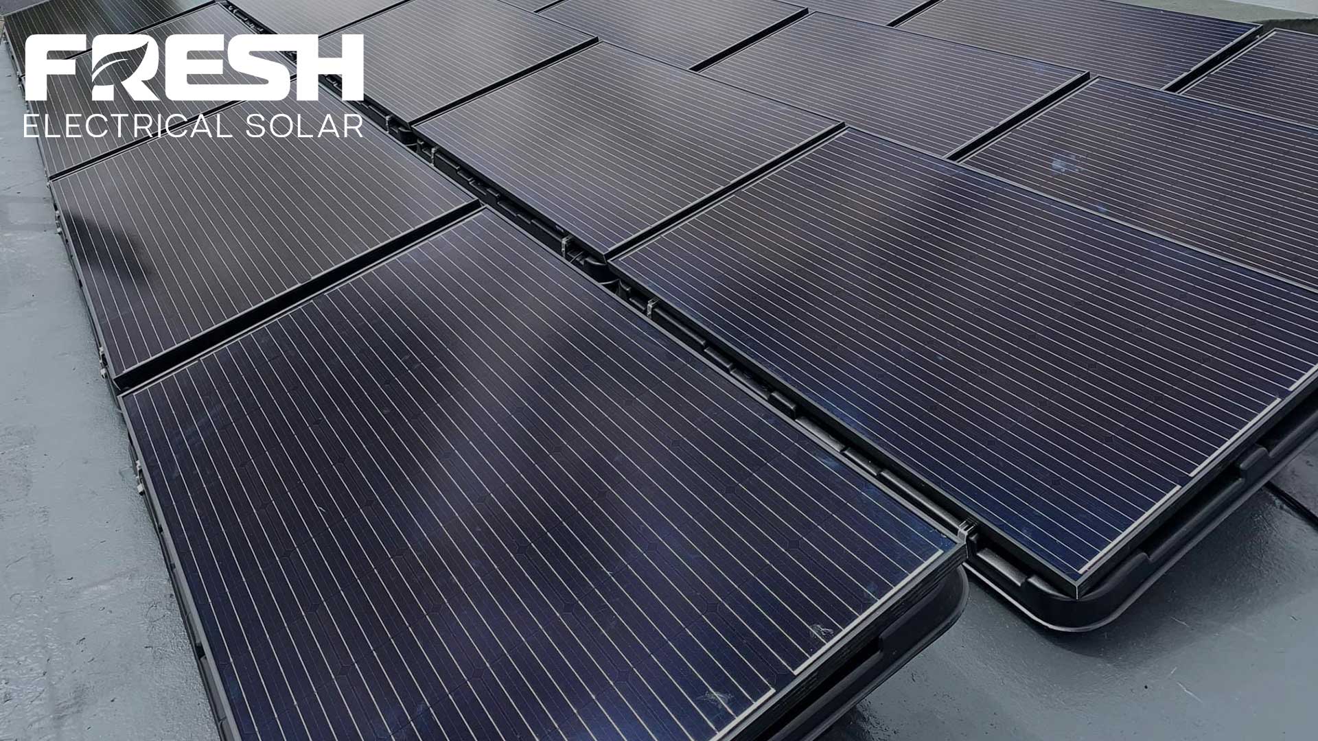 All Black Solar Panel Installation on a flat roof on tubs